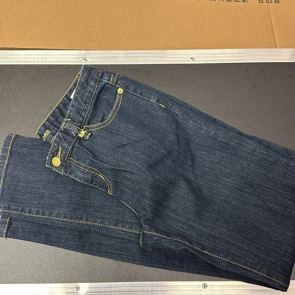 94.  Michael Kors dark blue skinny jeans with embellished pockets size 4